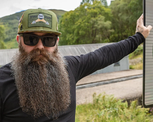 man facing camera with a full dense beard