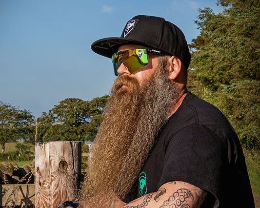 beard scottish man with sunglasses looking into distance