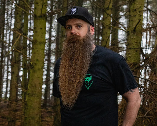 bearded man in woods with big beard